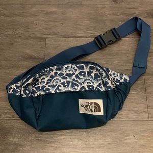 The North Face blue sling / lumbar / fanny pack
